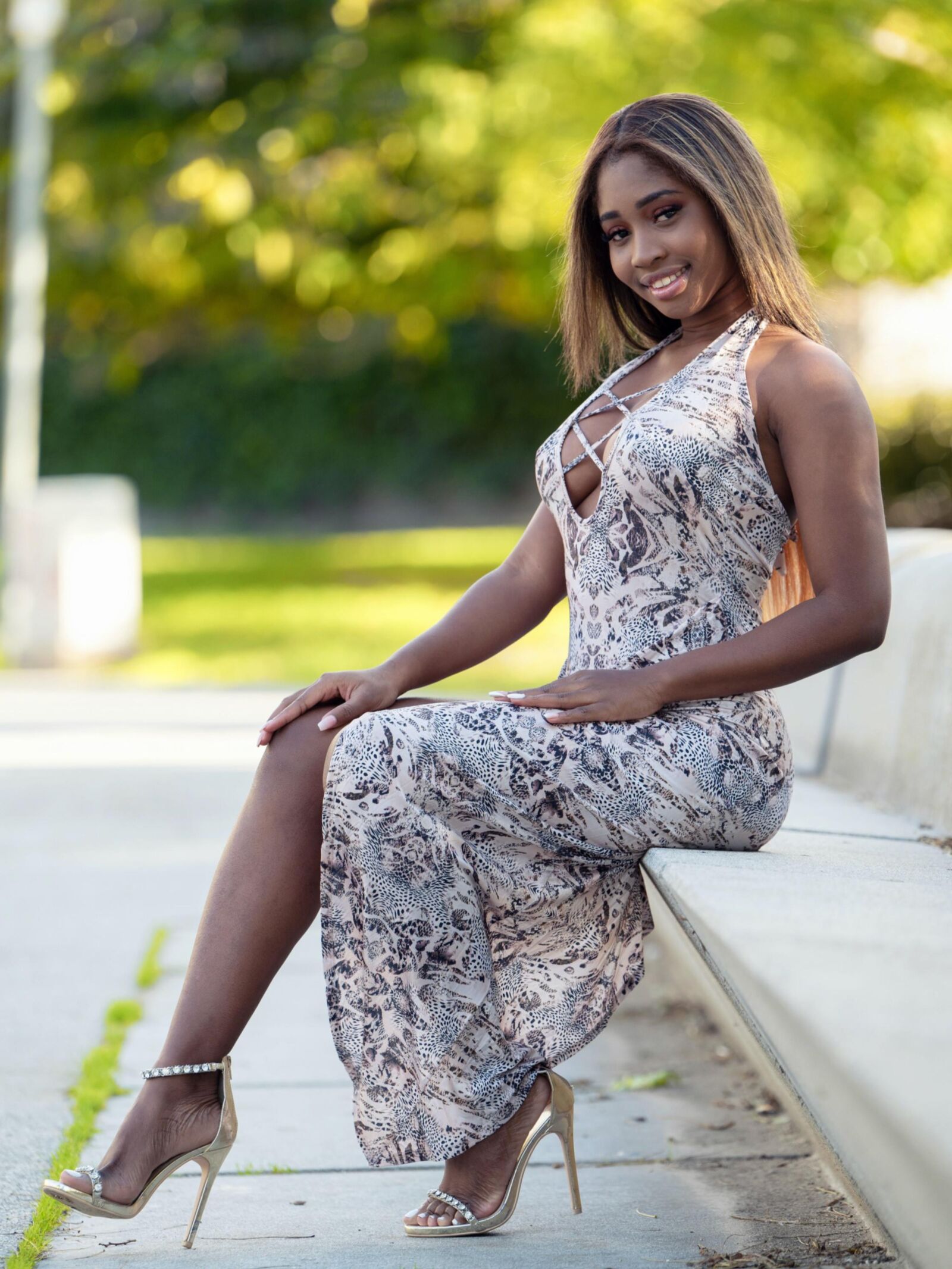 Ebony beauty naked on the window ledge