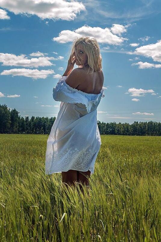 Blonde Anzhelika on the grass