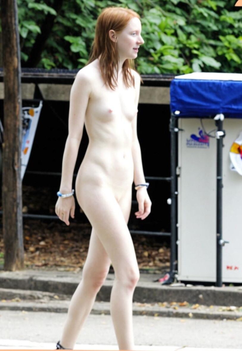 Pale slender redhead exposing herself nude roaming the streets