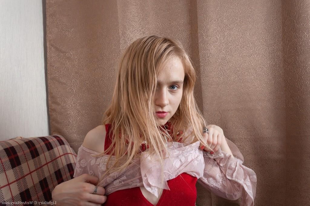 Masturbating on a sofa with a dildo