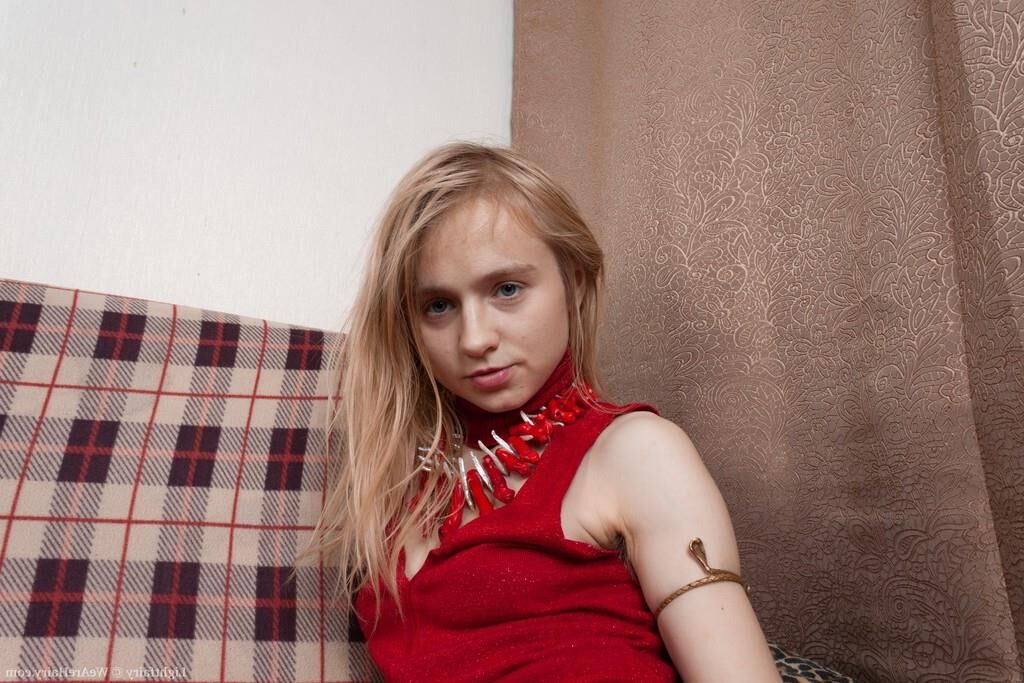 Masturbating on a sofa with a dildo