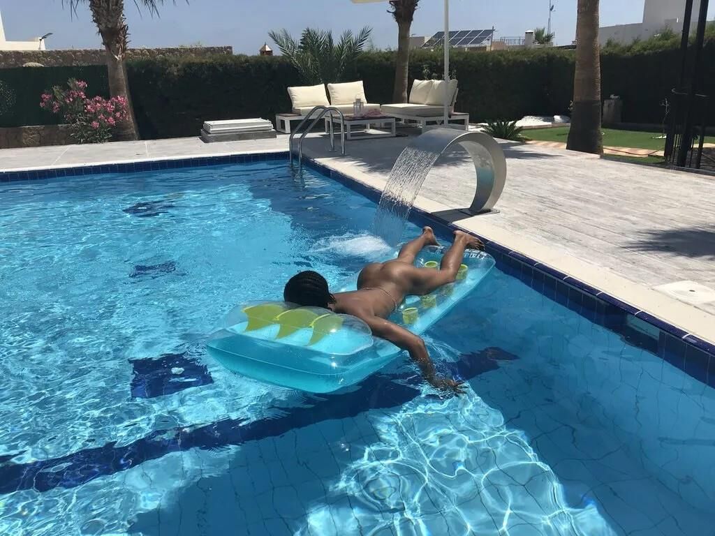 Slim Ebony Naked in Public Pool