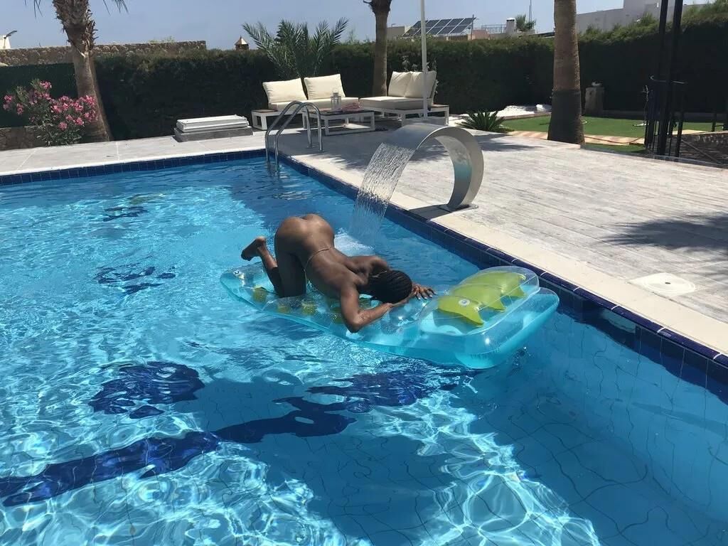 Slim Ebony Naked in Public Pool